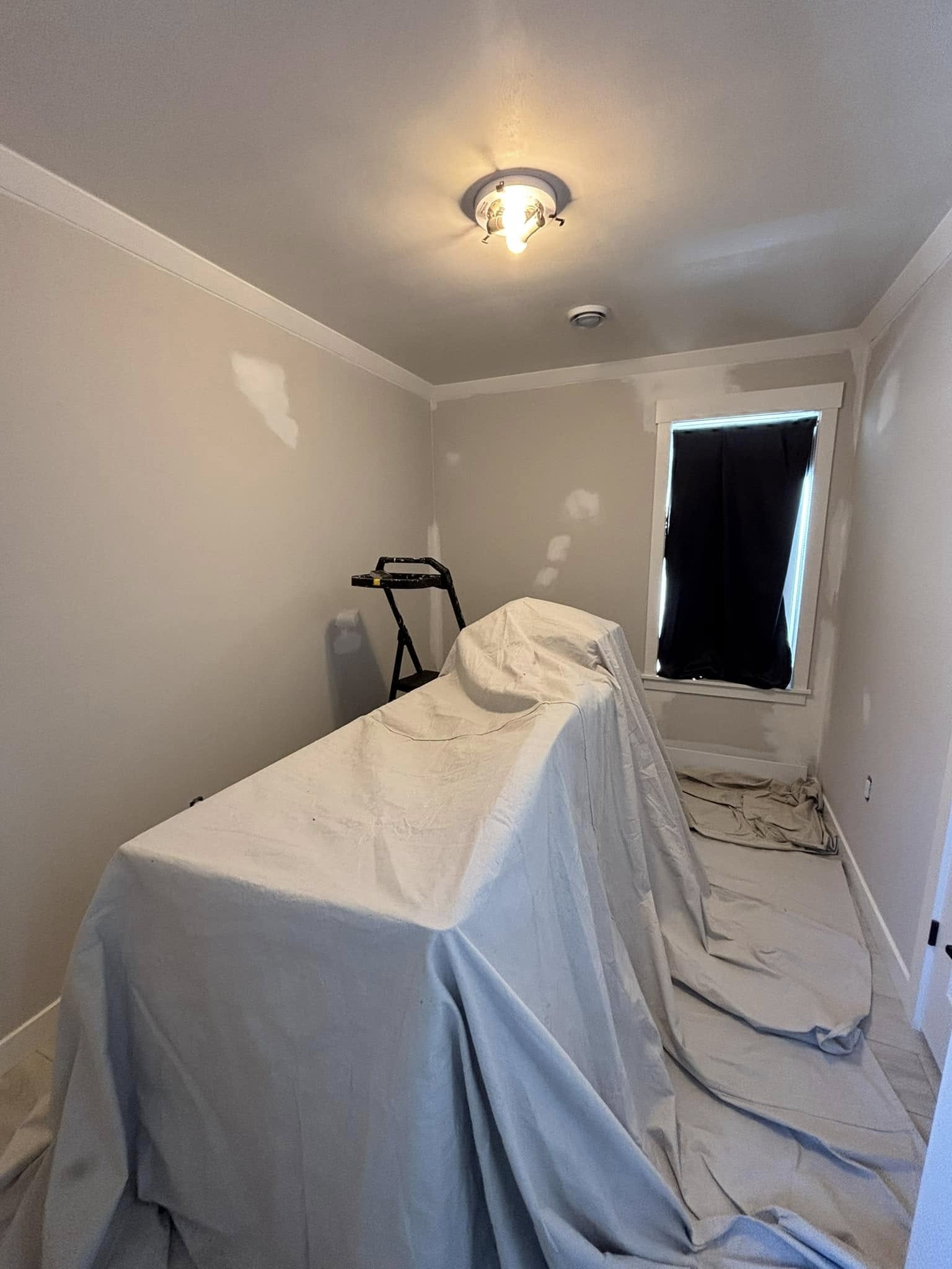 painting drywall interior patching with drop cloth